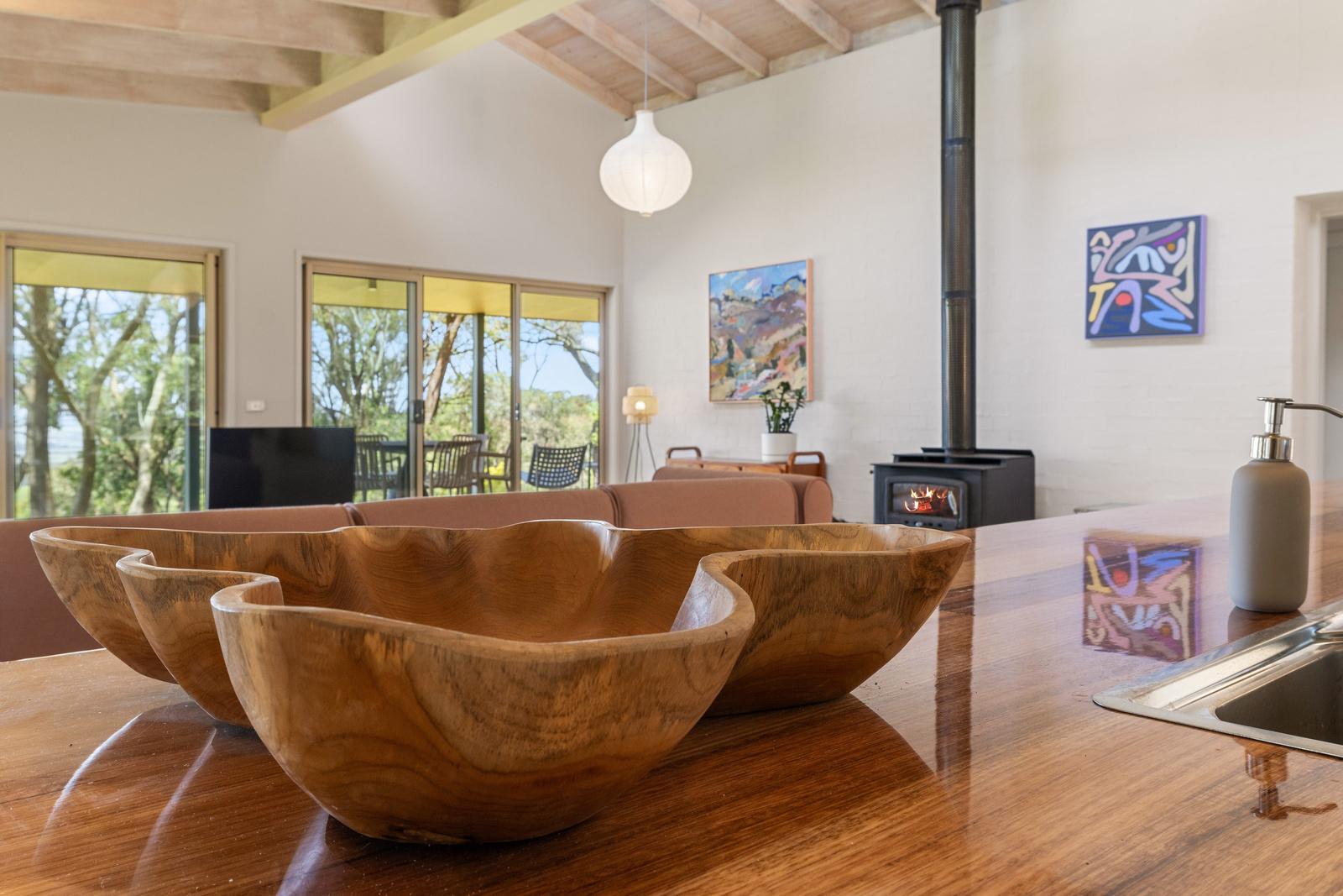 Main living room fireplace with wood-burning heater